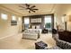 Bright and airy bedroom featuring large windows, neutral walls, and comfortable furniture, perfect for restful nights at 14200 W 86Th Pl, Arvada, CO 80005