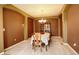 Formal dining room with elegant lighting, decorative arches, and ample space for entertaining guests at 14200 W 86Th Pl, Arvada, CO 80005