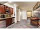 Charming kitchenette boasts stainless appliances, tile backsplash and flooring, and ample cabinet storage at 14200 W 86Th Pl, Arvada, CO 80005