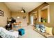 Spacious living room with comfortable seating arrangements and home gym, perfect for relaxation and exercise at 14200 W 86Th Pl, Arvada, CO 80005