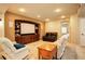 Inviting living room features a built-in entertainment center, recessed lighting, and comfortable seating at 14200 W 86Th Pl, Arvada, CO 80005