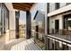 Stylish balcony featuring black railings and wooden decking offers a glimpse of the contemporary community design at 8260 E 36Th Ave # 30, Denver, CO 80238