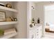 Stylish bathroom with floating shelves and a bedroom view at 8260 E 36Th Ave # 30, Denver, CO 80238
