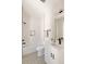 Bathroom featuring white subway tile, black fixtures, and a gray patterned tile floor at 8260 E 36Th Ave # 30, Denver, CO 80238
