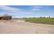 A well-maintained outdoor plaza with distant city buildings and open green spaces under a sunny, partly cloudy sky at 8260 E 36Th Ave # 30, Denver, CO 80238