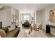 Spacious open concept living room with hardwood floors, modern furnishings, and natural light at 8260 E 36Th Ave # 30, Denver, CO 80238