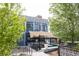 Outdoor dining area of FlyteCo Tower features modern architecture, ample seating, and shaded patio for a relaxed atmosphere at 8260 E 36Th Ave # 30, Denver, CO 80238