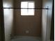This bathroom features a tub/shower combo with window providing natural light at 1575 Olympia Cir # 208, Castle Rock, CO 80104