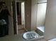 Bathroom includes a tile shower/tub surround and a neutral colored vanity at 1575 Olympia Cir # 208, Castle Rock, CO 80104