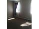 Bright bedroom with natural light and large windows draped with stylish curtains at 1575 Olympia Cir # 208, Castle Rock, CO 80104