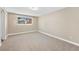 Neutral bedroom with plush carpet and a bright window with natural light at 6655 W Glasgow Ave, Littleton, CO 80128