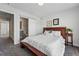 Bedroom with soft carpet, a large bed, and an ensuite bathroom at 1064 Depew St, Lakewood, CO 80214