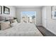 Comfortable bedroom featuring plush bedding and large window for natural light at 1064 Depew St, Lakewood, CO 80214