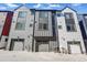 Modern townhouse exteriors with garages, showcasing contemporary design at 1064 Depew St, Lakewood, CO 80214
