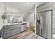 Stainless steel appliances in the kitchen featuring stone counter tops and an open floor plan at 1064 Depew St, Lakewood, CO 80214