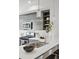 Modern kitchen with stainless steel appliances, gray cabinets and island with sink at 1064 Depew St, Lakewood, CO 80214