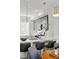Bright kitchen featuring stainless steel appliances, pendant lights, and island with breakfast bar at 1064 Depew St, Lakewood, CO 80214