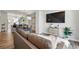 Open concept living room and dining area with modern decor and great flow at 1064 Depew St, Lakewood, CO 80214