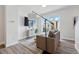 Comfortable living room has a large TV, modern decor, and a large window to enjoy the outside view at 1064 Depew St, Lakewood, CO 80214
