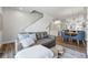 Open concept living room with modern decor, stairs, and view of the dining area at 1064 Depew St, Lakewood, CO 80214