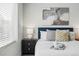 Cozy bedroom featuring a bedside table with lamp and soft pillows for a restful night at 1064 Depew St, Lakewood, CO 80214