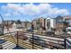 Neighborhood street view showcasing modern townhomes with balconies and well-maintained surroundings at 1064 Depew St, Lakewood, CO 80214