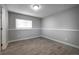 Basement with tile floor and a large window providing natural light at 8258 S Reed Way, Littleton, CO 80128