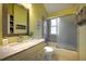 Bathroom featuring a sink, modern fixtures, and a shower/tub combination at 8258 S Reed Way, Littleton, CO 80128