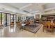 A cozy living room with bookshelves, fireplace, and comfortable seating at 2500 E Cherry Creek South Dr # 313, Denver, CO 80209