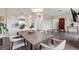 Bright living space featuring a dining area, hardwood floors, and an open kitchen creates an inviting and connected atmosphere at 2500 E Cherry Creek South Dr # 313, Denver, CO 80209