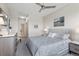 This main bedroom features a ceiling fan, television, and neutral tones at 2500 E Cherry Creek South Dr # 313, Denver, CO 80209