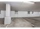 Concrete parking garage with numbered parking spots and block columns at 2500 E Cherry Creek South Dr # 313, Denver, CO 80209