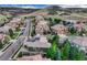 Stunning aerial view of a neighborhood with well-maintained homes, lush greenery, and a scenic mountain backdrop at 10459 Rivington Ct, Lone Tree, CO 80124