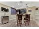 Basement featuring bar seating, stainless steel appliances, and wood floors at 10459 Rivington Ct, Lone Tree, CO 80124