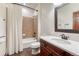 Bathroom with tile shower, white shower curtain and vanity with white countertop at 10459 Rivington Ct, Lone Tree, CO 80124