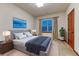 Comfortable bedroom with large bed, bedside tables, and views from the window at 10459 Rivington Ct, Lone Tree, CO 80124