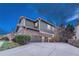 Spacious three-car garage with an expansive driveway and complementary exterior at 10459 Rivington Ct, Lone Tree, CO 80124