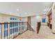Open hallway overlooking the living room below, complete with an office nook at 10459 Rivington Ct, Lone Tree, CO 80124