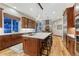 Spacious kitchen with a large center island, stainless steel appliances, and modern finishes at 10459 Rivington Ct, Lone Tree, CO 80124