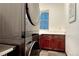 Modern laundry room features a stacked washer and dryer, with lots of storage space at 10459 Rivington Ct, Lone Tree, CO 80124