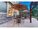 Charming outdoor patio with dining and seating areas, creating an ideal spot for gatherings and relaxation at 10459 Rivington Ct, Lone Tree, CO 80124