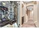 Elegant wine cellar featuring a glass door, custom racking for wine storage, and a sophisticated design at 10459 Rivington Ct, Lone Tree, CO 80124