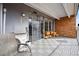 Spacious balcony featuring durable tiled flooring, ample seating, and sliding glass doors for seamless indoor-outdoor living at 955 Eudora St # 307E, Denver, CO 80220