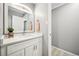 Modern bathroom featuring a white vanity with ample storage and contemporary lighting, creating a clean and bright space at 955 Eudora St # 307E, Denver, CO 80220