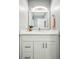 Modern bathroom featuring a white vanity with ample storage and contemporary lighting, creating a clean and bright space at 955 Eudora St # 307E, Denver, CO 80220