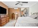 Bedroom includes balcony access, a ceiling fan, and modern furnishings with a neutral palette at 955 Eudora St # 307E, Denver, CO 80220