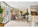 Dining area with a glass table, chairs, and an adjacent balcony area at 955 Eudora St # 307E, Denver, CO 80220