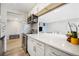 Updated kitchen with marble countertops, stainless steel appliances, and mosaic backsplash at 955 Eudora St # 307E, Denver, CO 80220