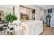 Bright kitchen featuring white cabinets, quartz countertops, and modern appliances at 955 Eudora St # 307E, Denver, CO 80220