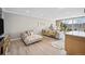 Inviting living room with neutral colors, hardwood floors, and large glass windows at 955 Eudora St # 307E, Denver, CO 80220